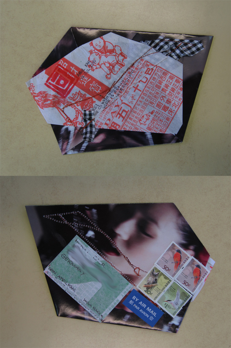 Red seal impressions stamped across white paper, and below it a sleeping face beside a block of stamps